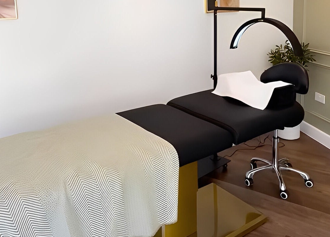 Luxury treatment bed at Refine by Abbie Baker in Wouldham, GB with soft lighting and elegant decor.