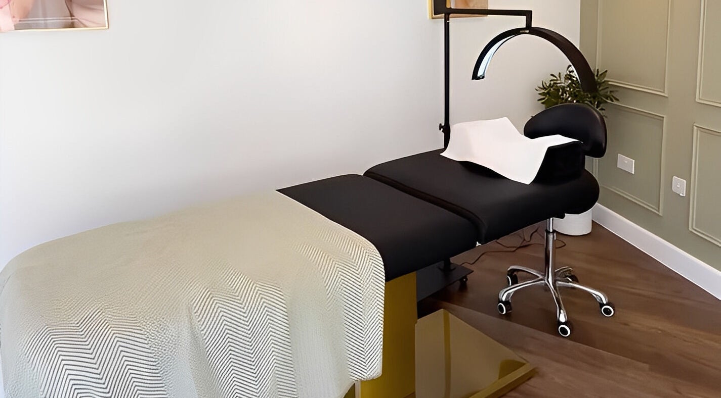 Luxury treatment bed at Refine by Abbie Baker in Wouldham, GB with soft lighting and elegant decor.