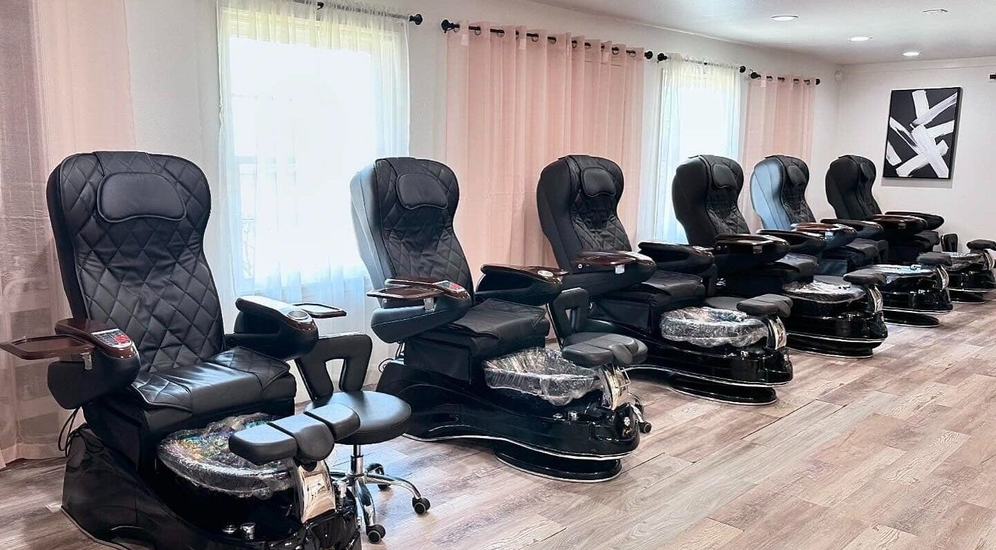 Luxurious pedicure chairs lined up at Ark Beauty Ink in Bentonville, Arkansas, US offering premium comfort.