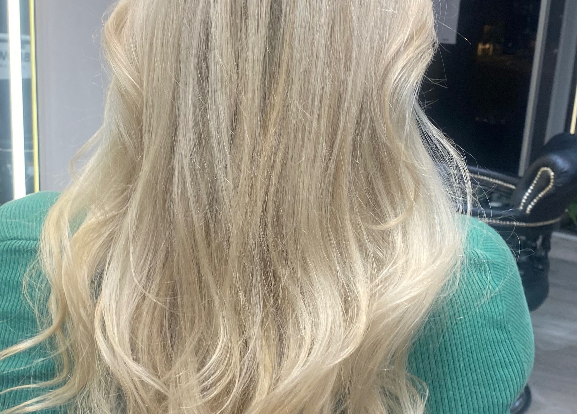 Blonde hair styled in soft waves at Just Gorgeous by Paty Silva, London, England, GB.