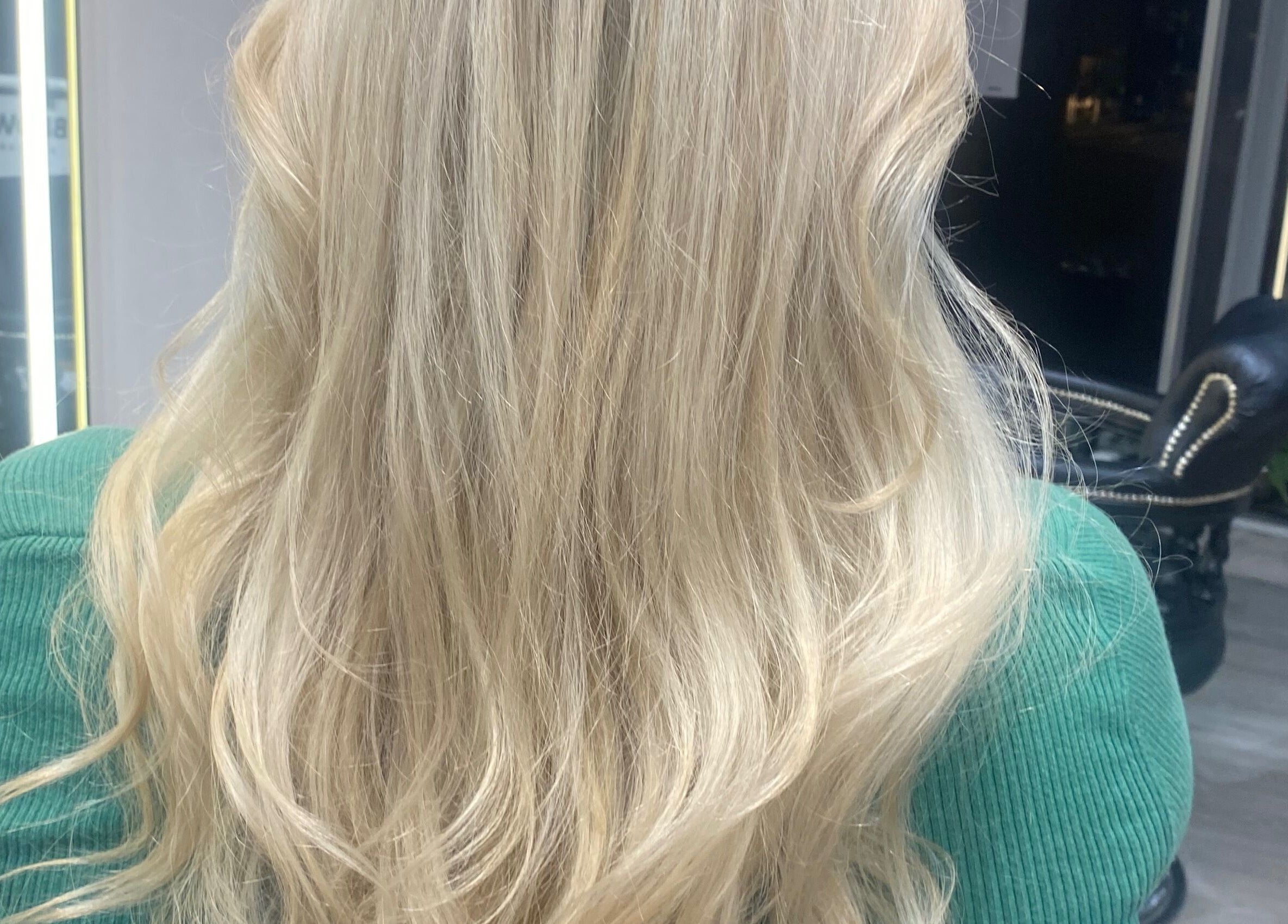 Blonde hair styled in soft waves at Just Gorgeous by Paty Silva, London, England, GB.