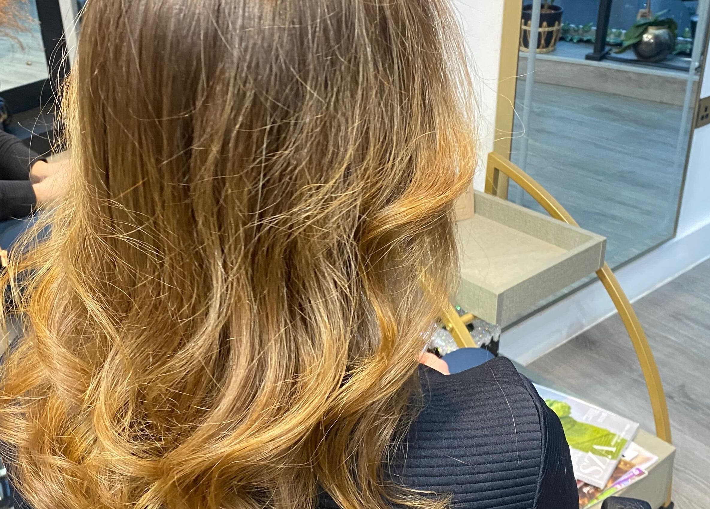 Stylish wavy hairstyle at Just Gorgeous by Paty Silva, London, England, GB.