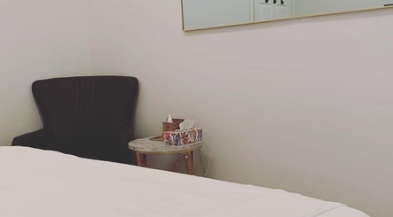 Relaxing chair and table setup in Blossom Health, Massage Therapy and Manual Osteopathy, Toronto, Ontario, CA.