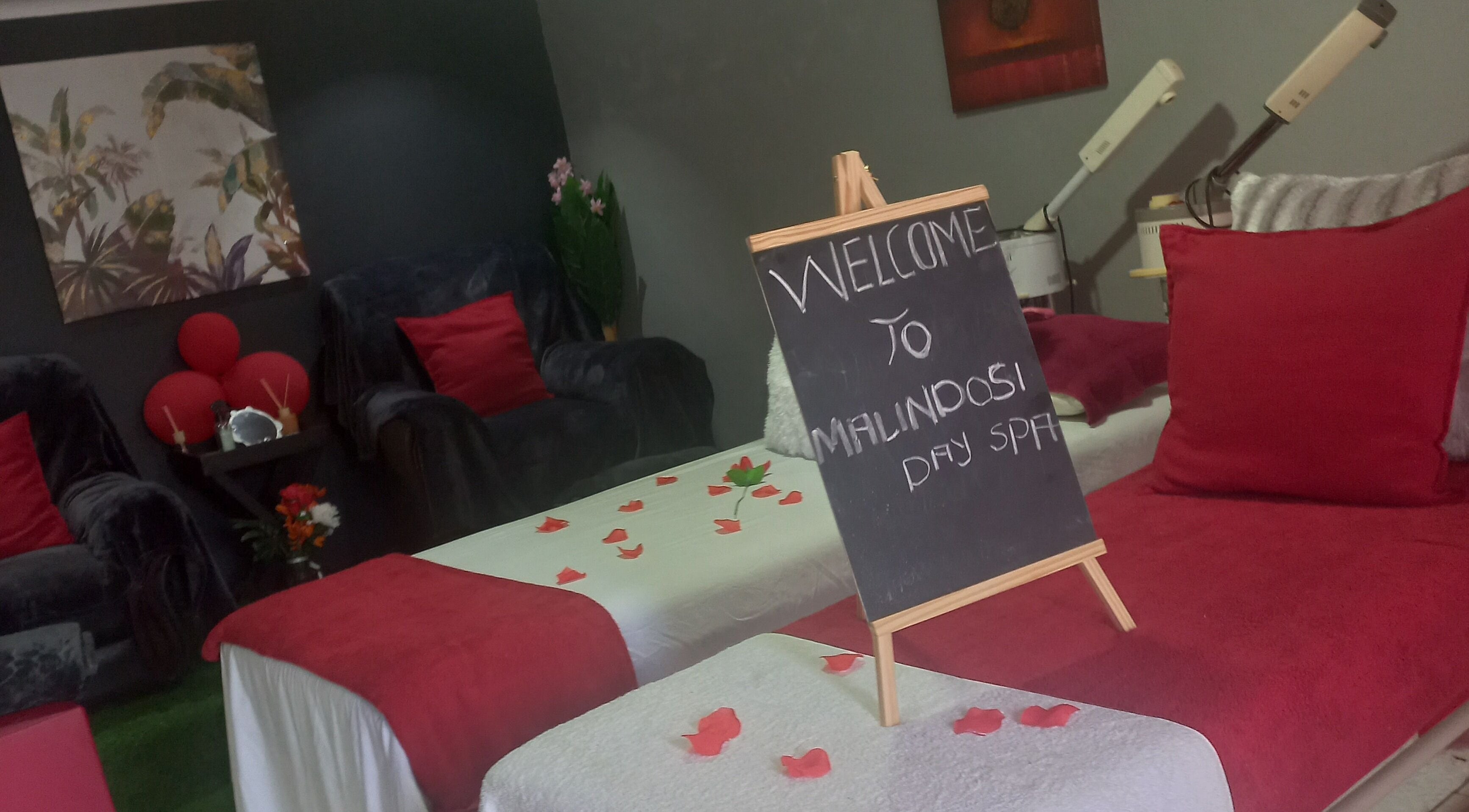 Welcoming interior of Malindosi Spa, Roodepoort, Gauteng, ZA, with elegant decor and cozy treatment beds.