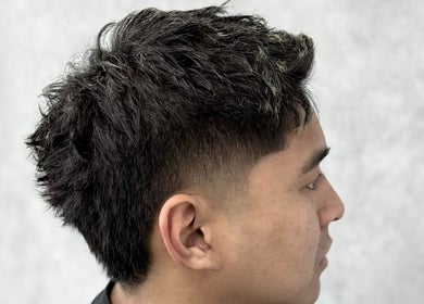 Stylish haircut at 9t3 Barber Studio in Auckland, NZ, featuring a modern fade.