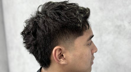 Stylish haircut at 9t3 Barber Studio in Auckland, NZ, featuring a modern fade.