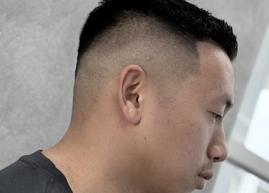 Close-up of a sharp fade haircut at 9t3 Barber Studio, Auckland, Auckland, NZ, showcasing precision styling.