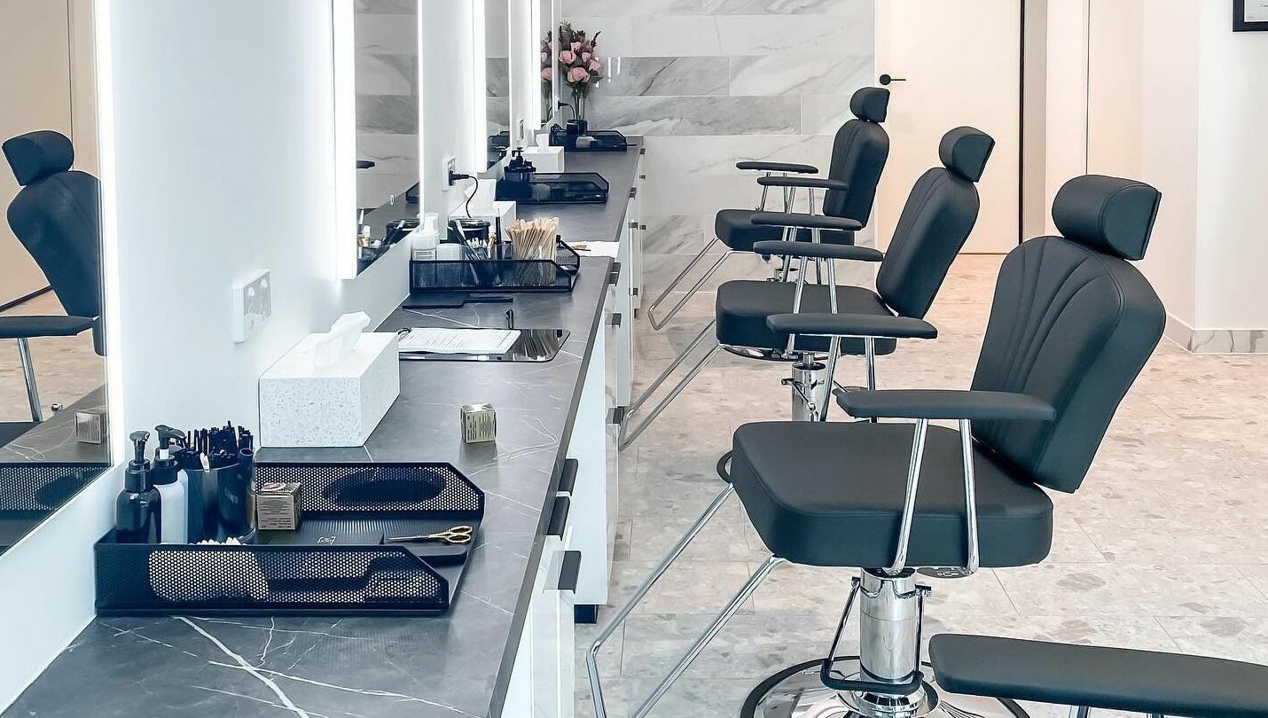 Elegant salon chairs and styling stations at Thread'In Shape - Caddens, Caddens, New South Wales, AU.