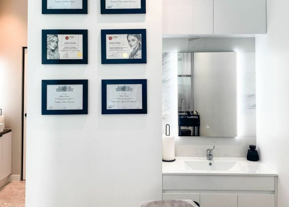 Framed certificates on a wall at Thread'In Shape - Caddens, Caddens, New South Wales, AU, showcasing expertise.