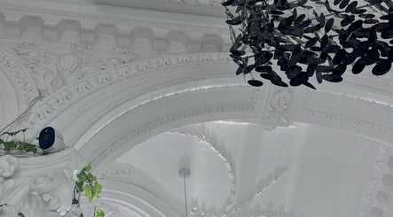 Ornate white ceiling with hanging decor at Hair by Daria Grosu, Bristol, England, GB.