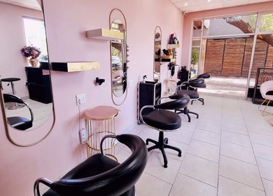 Stylish seating and mirrors at Roots Color Studio Hairdressing, Bloemfontein, Free State, ZA.