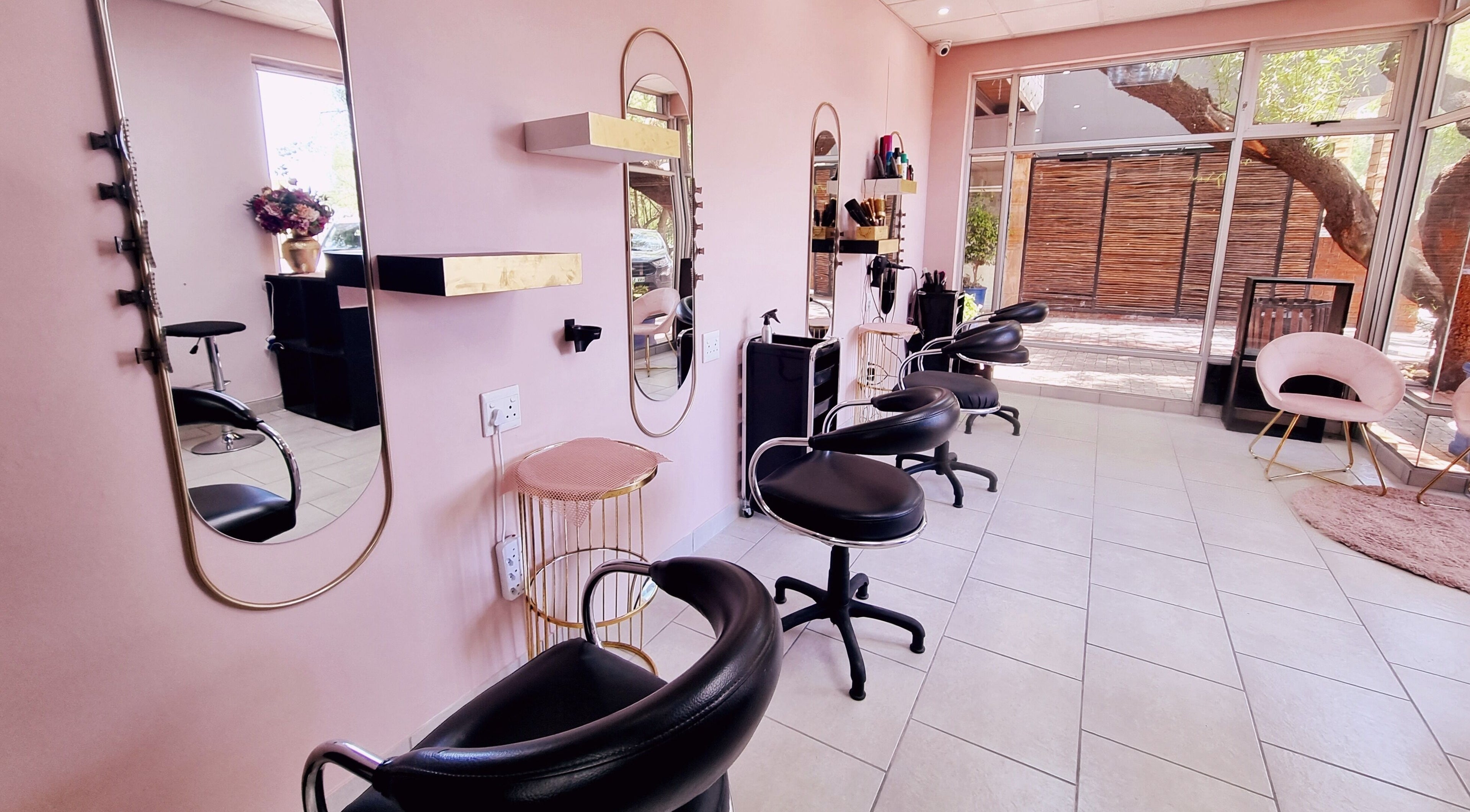 Stylish seating and mirrors at Roots Color Studio Hairdressing, Bloemfontein, Free State, ZA.