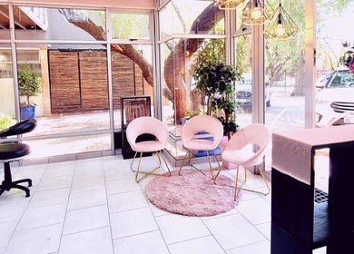 Inviting seating area at Roots Color Studio Hairdressing, Bloemfontein, Free State, ZA with natural light.