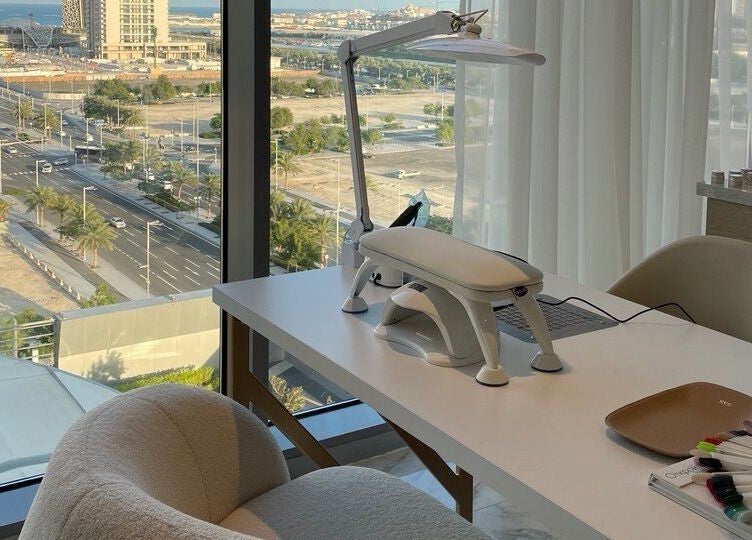 Bright workspace view at Re:Vision Studio, لوسيل, بلدية الضعاين, QA with cityscape outside.