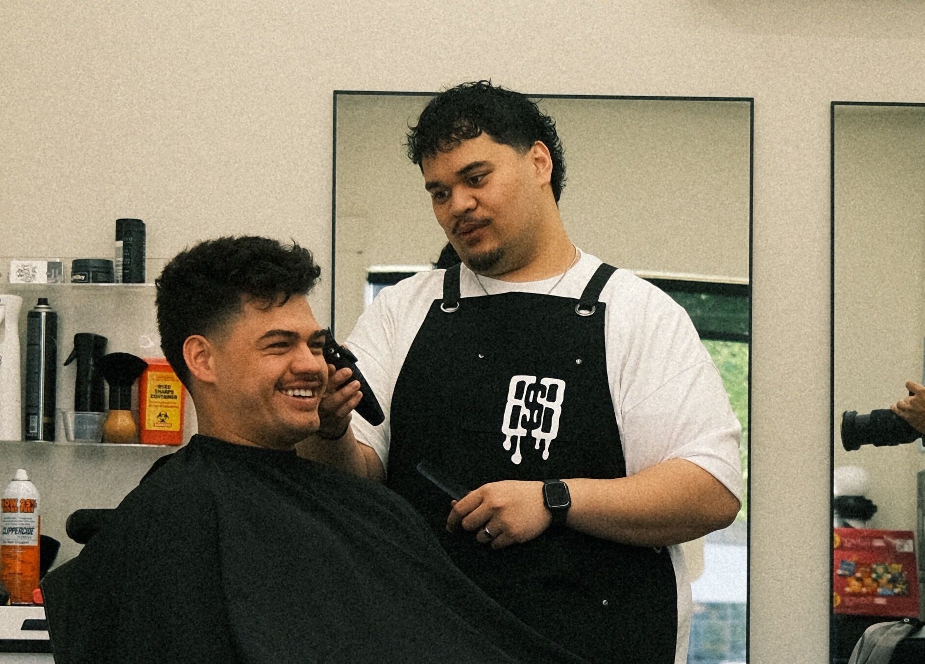 Barber styling client at Reezy at Blurry Boy$ Club, Pleasant Grove, Utah, US.