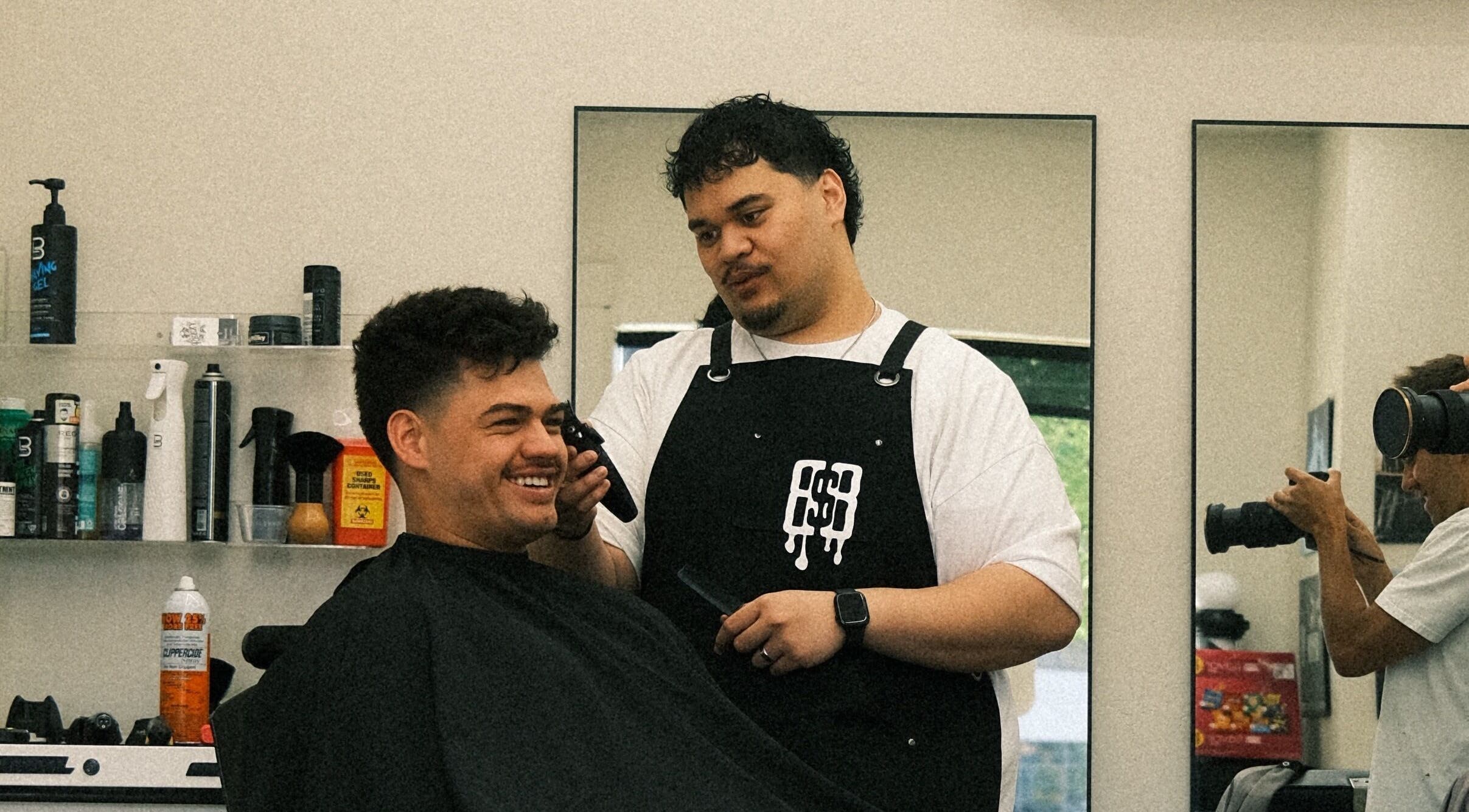 Barber styling client at Reezy at Blurry Boy$ Club, Pleasant Grove, Utah, US.