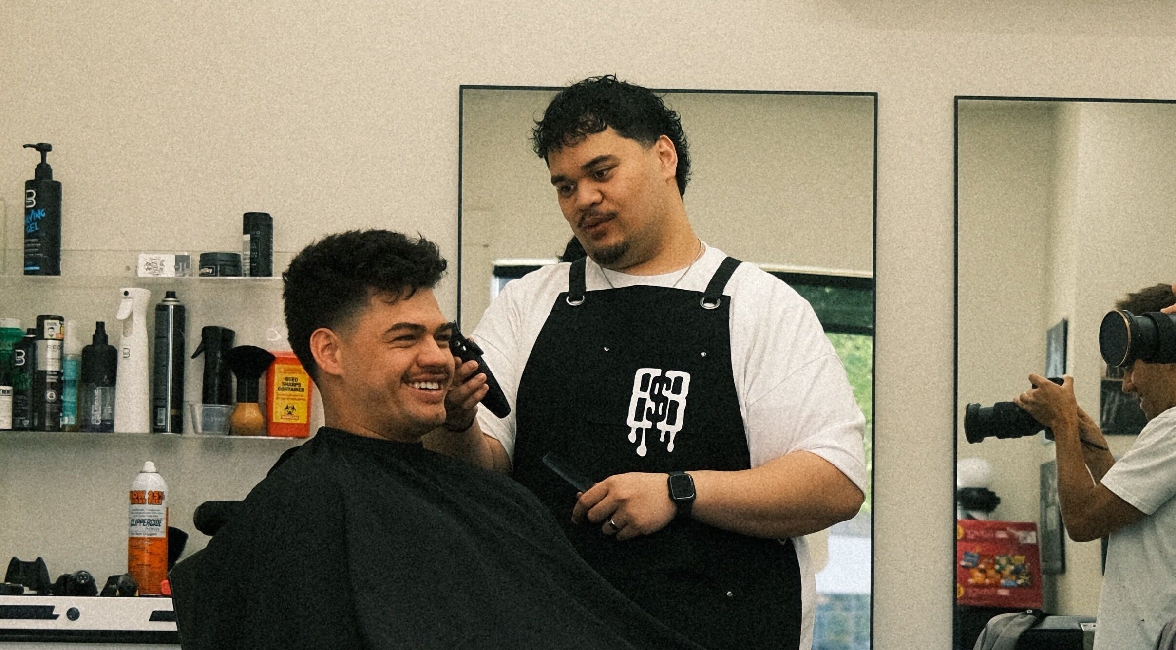 Barber styling client at Reezy at Blurry Boy$ Club, Pleasant Grove, Utah, US.