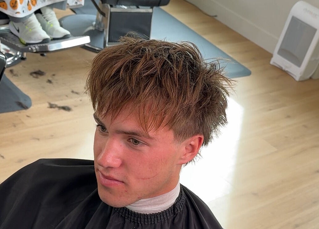 Young man with trendy haircut at Reezy, Blurry Boy$ Club, Pleasant Grove, Utah, US.