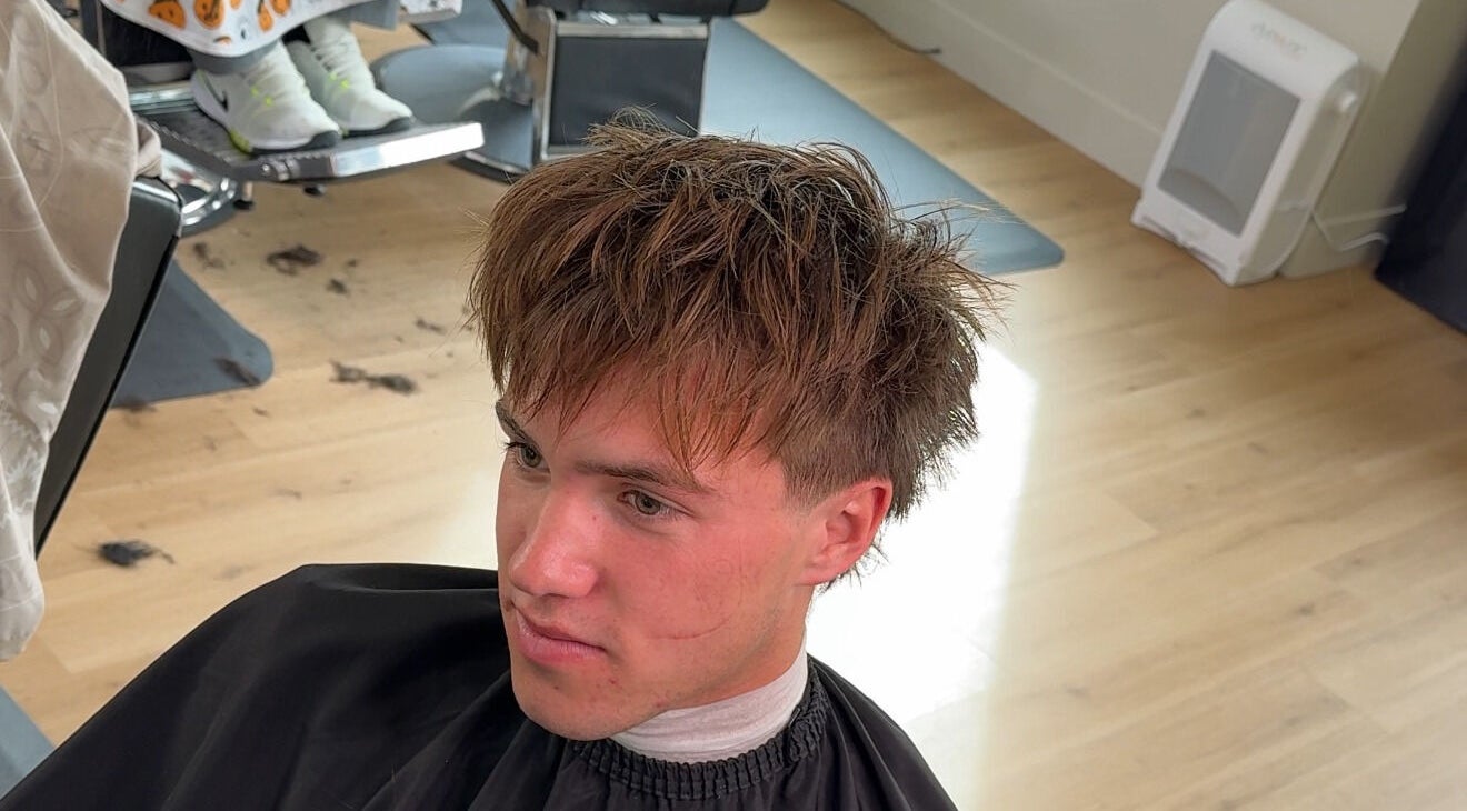 Young man with trendy haircut at Reezy, Blurry Boy$ Club, Pleasant Grove, Utah, US.