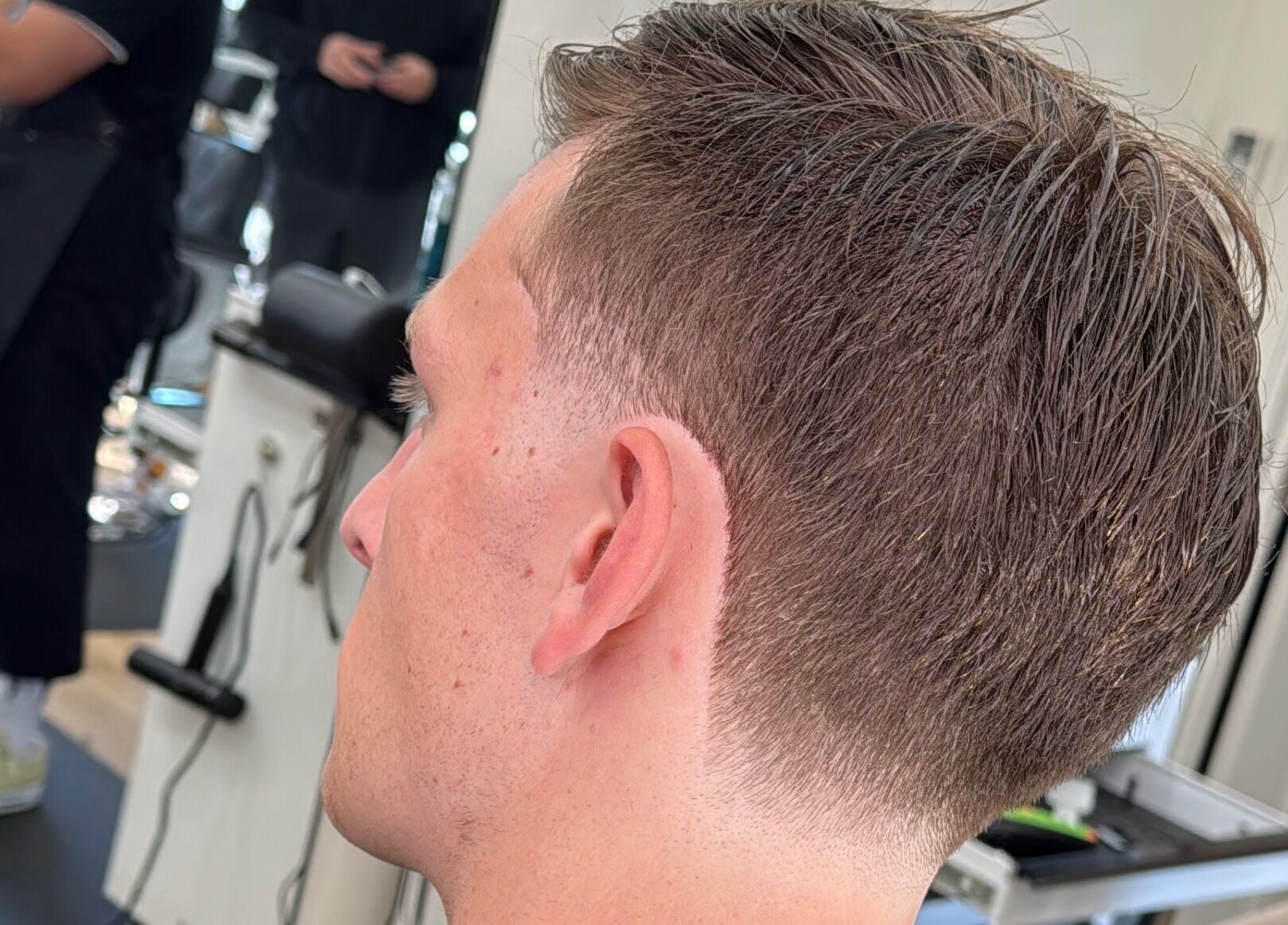 Close-up of a fresh haircut at Reezy at Blurry Boy$ Club, Pleasant Grove, Utah, US.