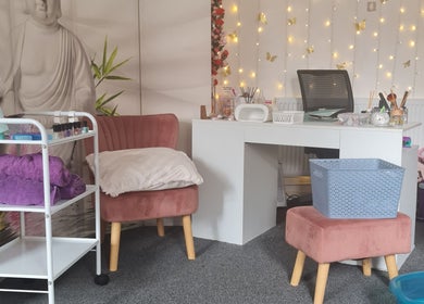 Beautylicious nail and beauty treatment area with plush seating and decor in Poole, England, GB.