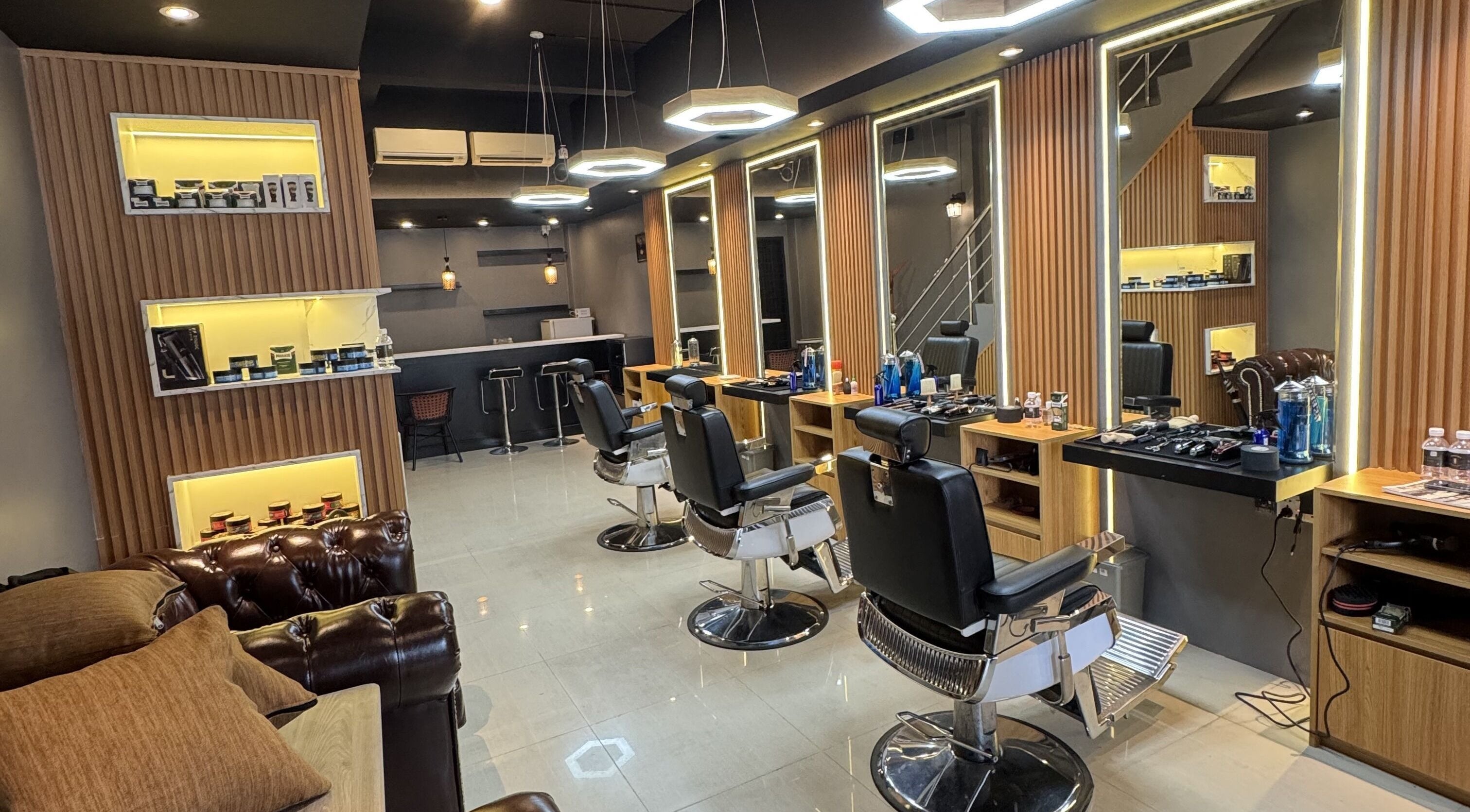 Interior of Barberlogy Barbershop - Zawana, Yangon, Yangon Region, MM, featuring stylish chairs and mirrors.