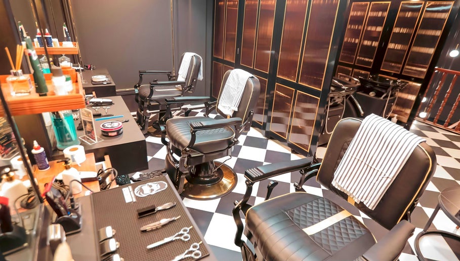 Barberlogy Barbershop - Shinsawpu in Yangon with stylish barber chairs and grooming tools.