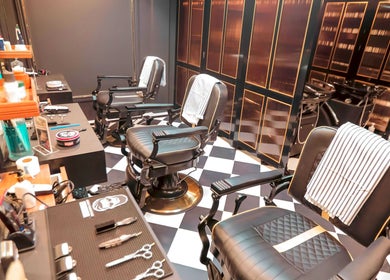 Barberlogy Barbershop - Shinsawpu in Yangon with stylish barber chairs and grooming tools.