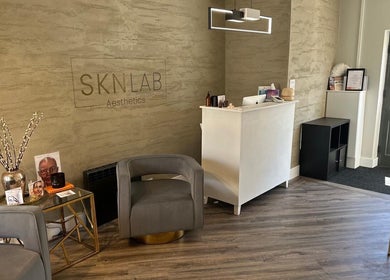 Elegant reception at Amy Salmon Aesthetics, Ware, England, GB, featuring contemporary decor and seating.