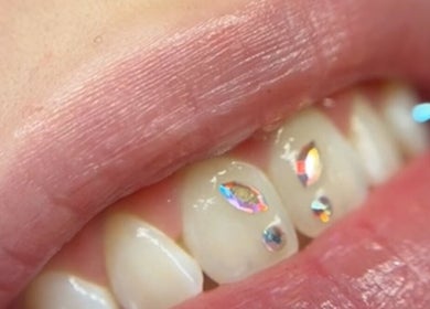 Close-up of jeweled tooth art at Vi.lash you Westmount, London, Ontario, CA.