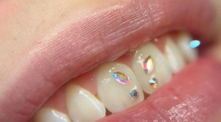 Close-up of jeweled tooth art at Vi.lash you Westmount, London, Ontario, CA.