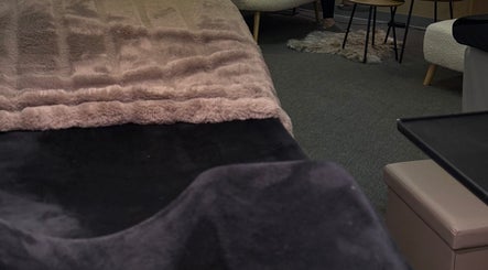 Comfortable treatment area at Vi.LashYou Westmount, London, Ontario, CA with plush furnishings.