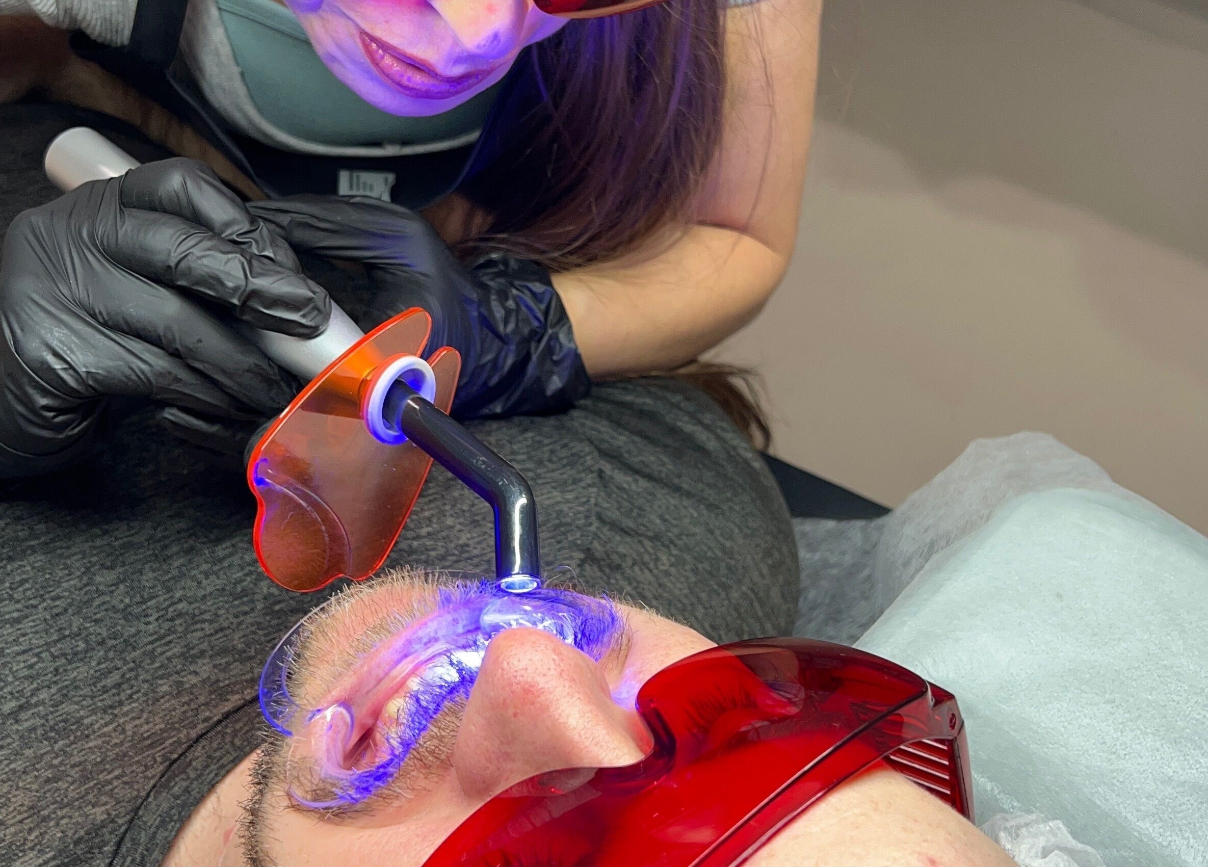 Specialist performing laser treatment at Vi.LashYou Westmount, London, Ontario, CA, enhancing eye care.