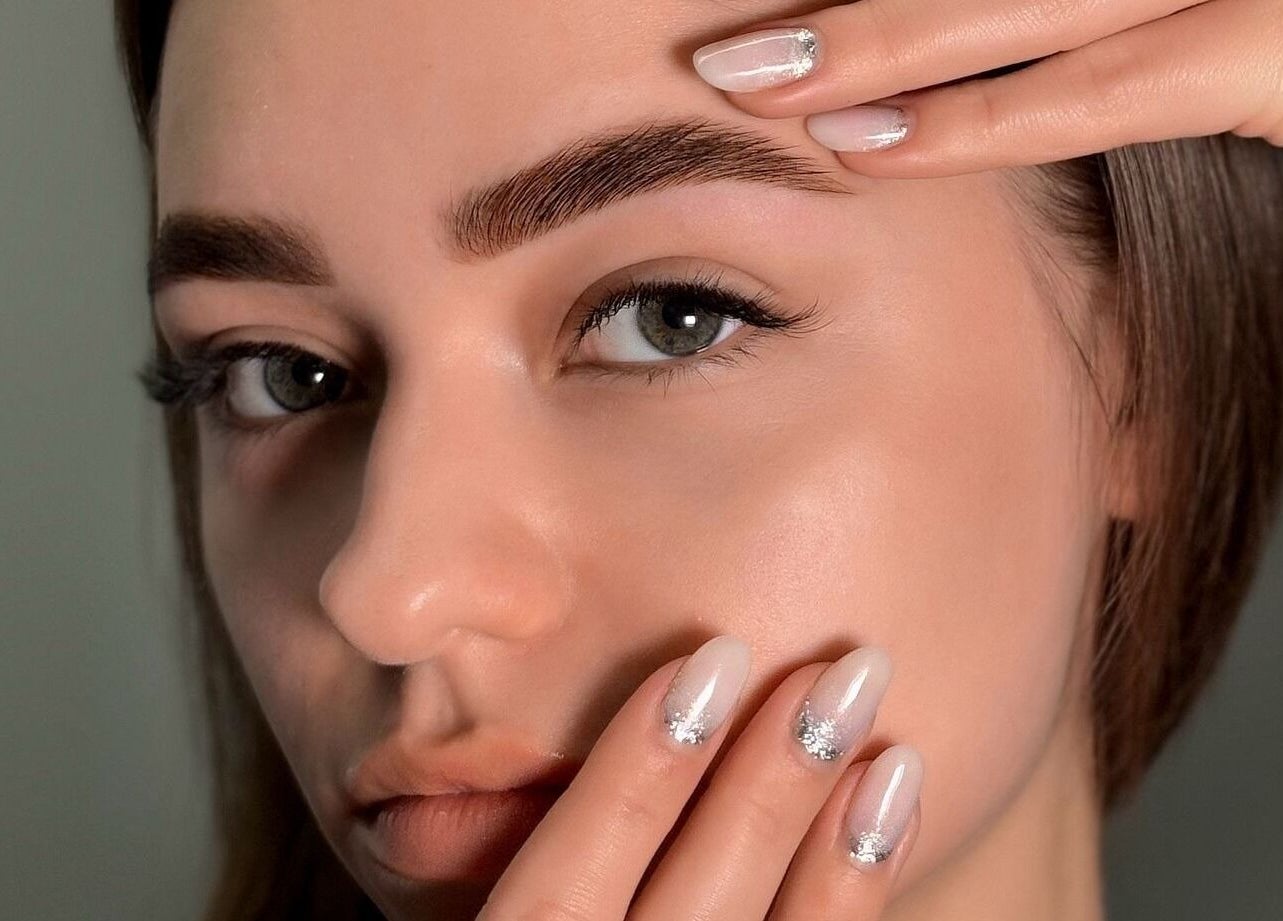 Close-up of a woman's well-groomed brows and nails at Vi.LashYou Westmount, London, Ontario, CA.