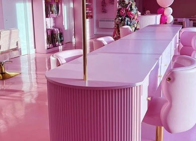 Chic pink interior of Gels by Renata in Middlesbrough, England, GB features elegant seating and decor.