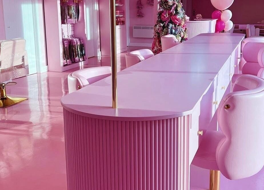 Chic pink interior of Gels by Renata in Middlesbrough, England, GB features elegant seating and decor.