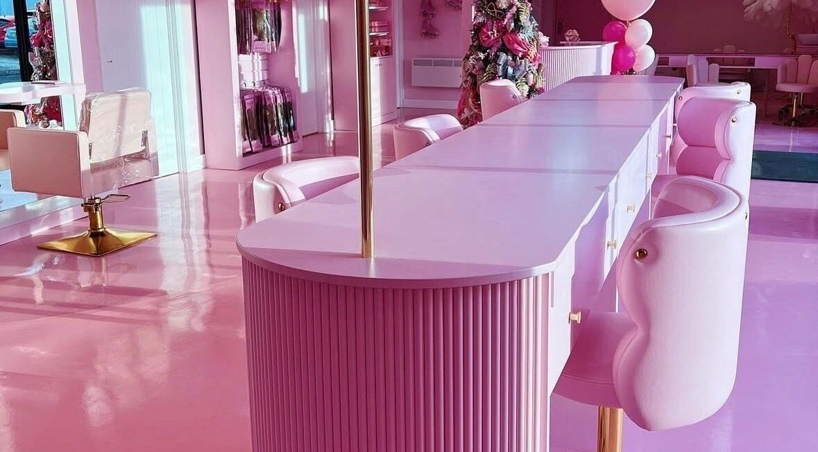 Chic pink interior of Gels by Renata in Middlesbrough, England, GB features elegant seating and decor.