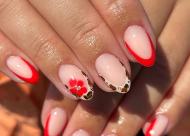 Stylish floral nail art at Gels by Renata, Middlesbrough, England, GB featuring red and leopard print.