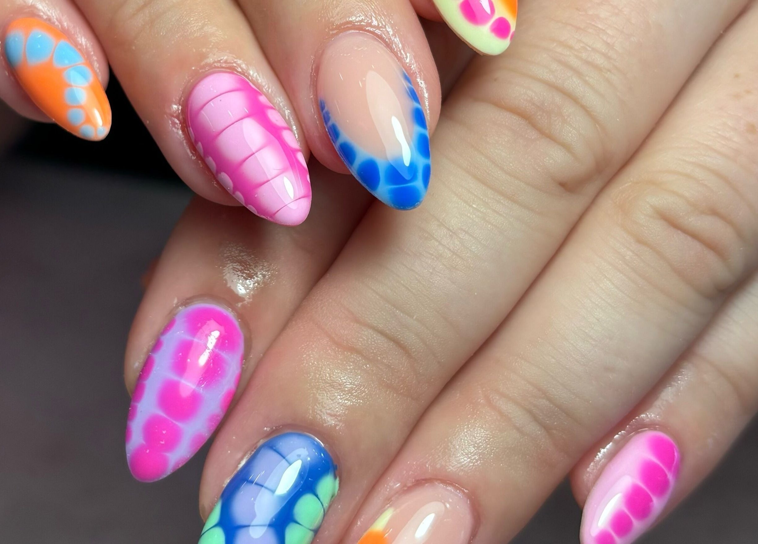 Vibrant nail art from Gels by Renata, Middlesbrough, England, GB. Rainbow hues and intricate designs.