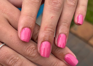 Close-up of shiny pink nails by Shanté at Nails by Shanté, Pretoria, Gauteng, ZA.