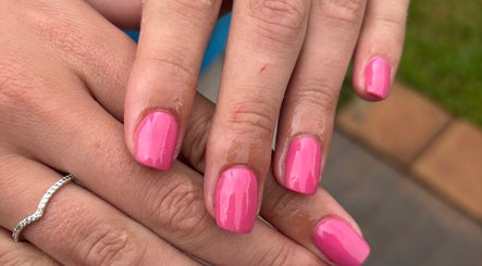 Close-up of shiny pink nails by Shanté at Nails by Shanté, Pretoria, Gauteng, ZA.
