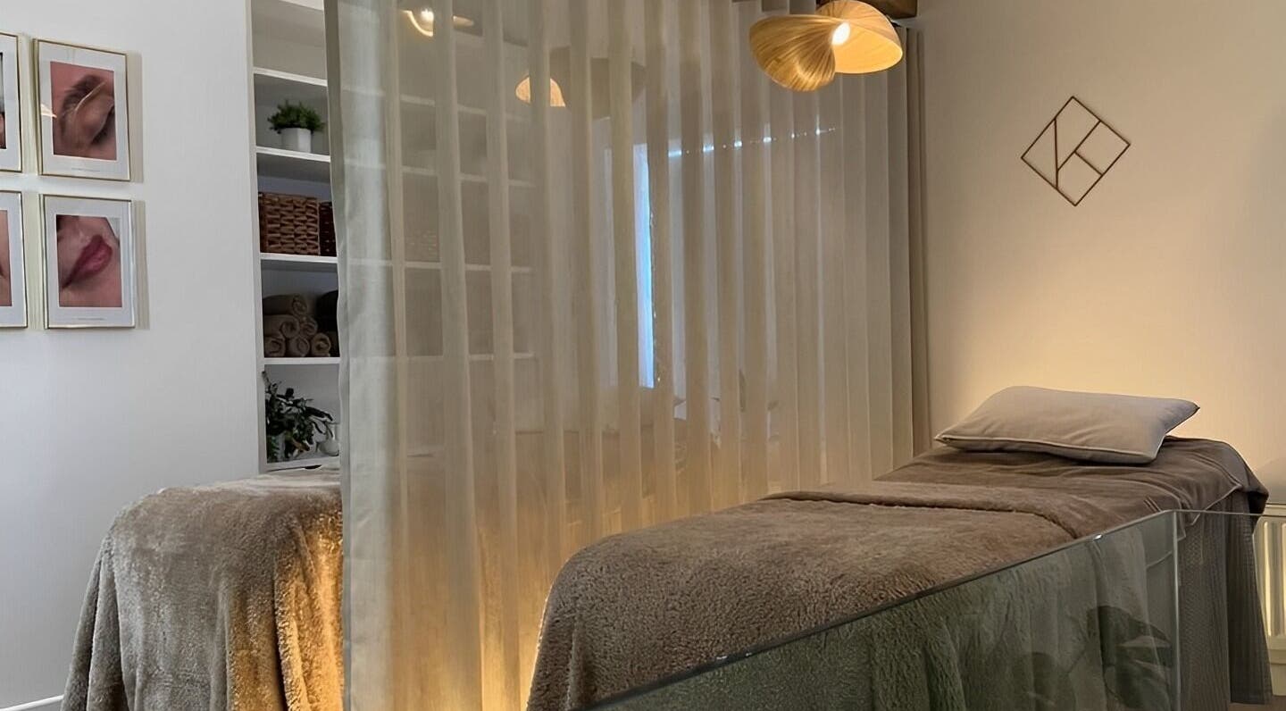 Luxurious treatment room with a plush bed at Kosmetiko Clinic, Kirkburton, England, GB, perfect for relaxation.