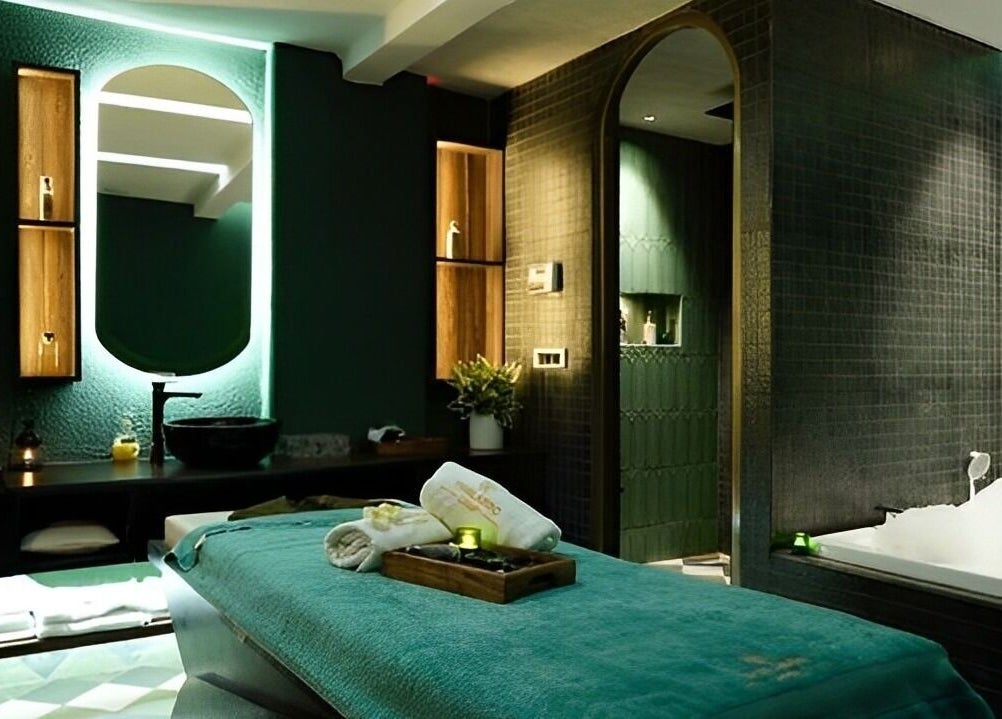 Luxurious treatment room at Thalasso Spa (Vasant Vihar), New Delhi, Delhi, IN, featuring a massage table and tub.