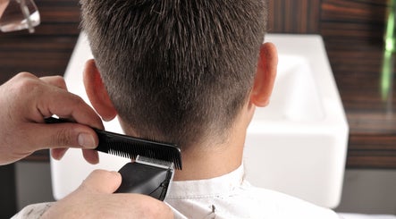 Child getting a haircut at Kids Best UAE, Dubai, Dubai, AE. Professional barber service.