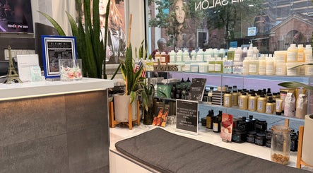 Reception area at Bleu Ciel, New York, New York, US showcasing beauty products and sleek modern decor.