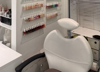 Nail polish display and salon chair at Bleu Ciel hair salon in New York, New York, US.