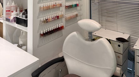 Nail polish display and salon chair at Bleu Ciel hair salon in New York, New York, US.