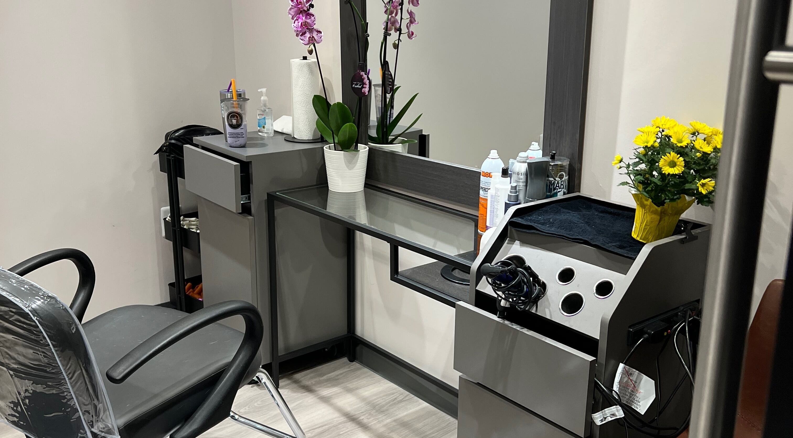 Stylish salon interior at JEN Salon from Salon Lofts, Fairfax, Virginia, US, featuring modern styling chair and decor.