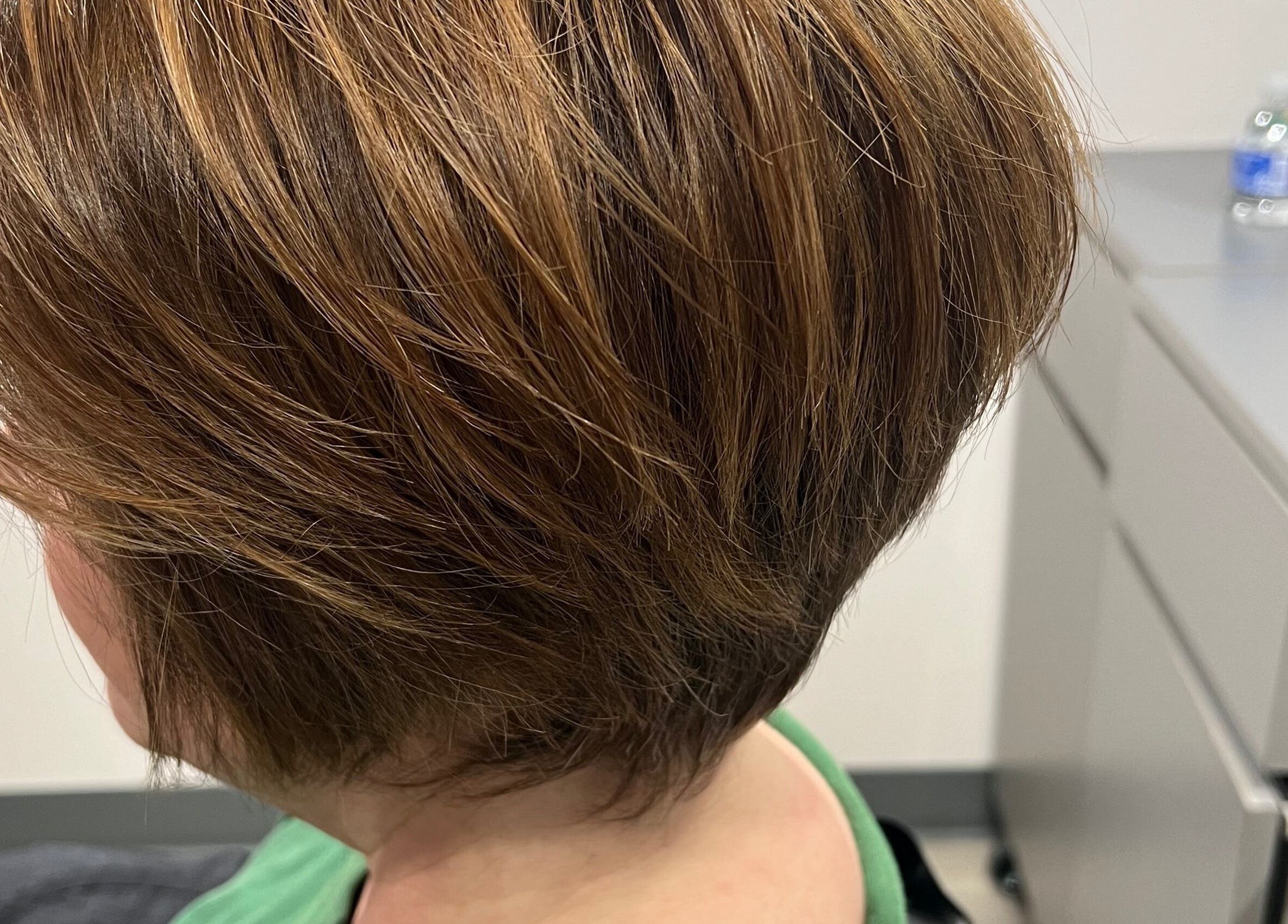 Side view of a chic bob haircut at JEN Salon from Salon Lofts, Fairfax, Virginia, US.