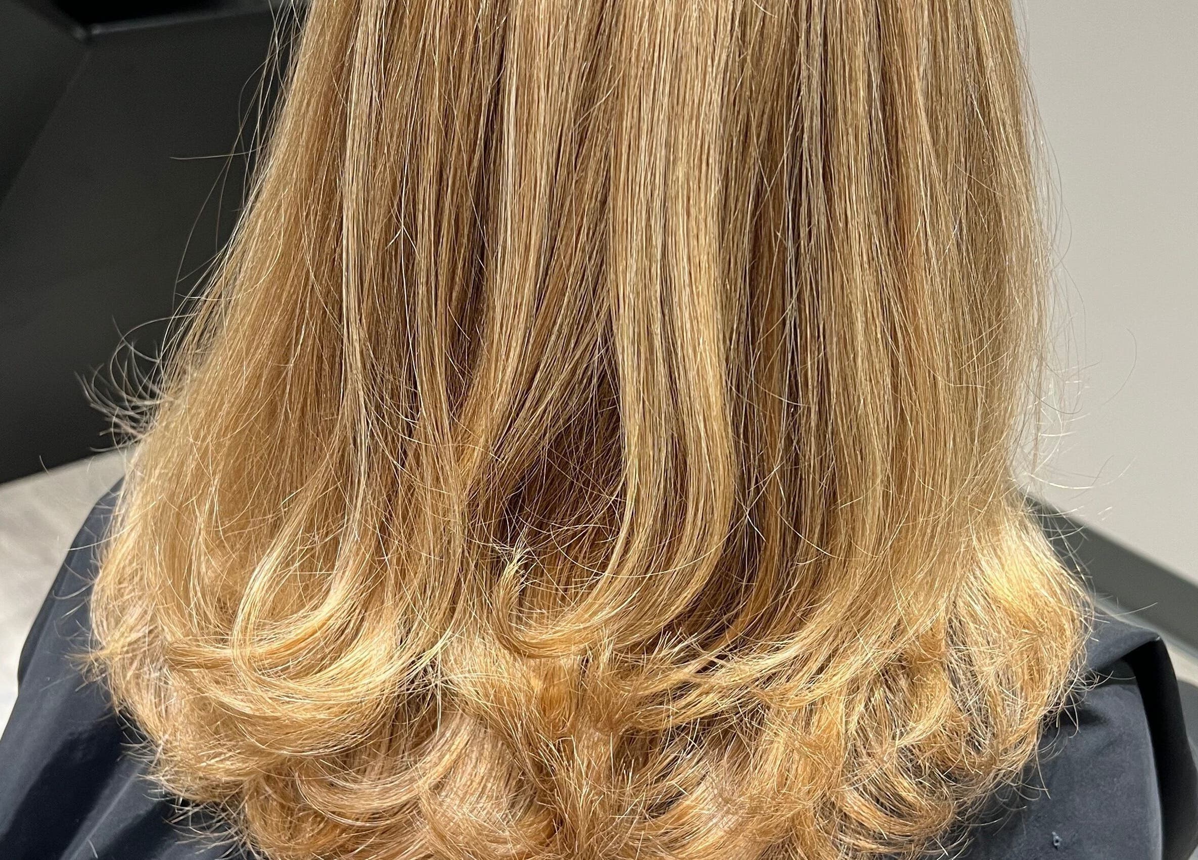 Stylish shoulder-length blonde hairstyle at JEN Salon from Salon Lofts, Fairfax, Virginia, US.
